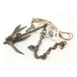 A small anchor from a rowing boat and a small rope and fitting for a flag G+