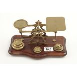 A set of brass postal scales on recent mahogany base