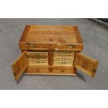 An unused large pine chest 42"x 27"x 30" refitted as a tool chest with eight inlaid drawers behind