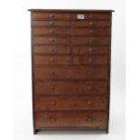 A 16 drawer pine chest with mahogany top and drawer fronts 21"x 15"x 33" tall.