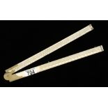 A rare 2' two fold ivory slide rule with steel tips brass hinge by W.