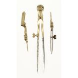 An 18c French pair of steel tipped brass dividers with 3 tools and early brass thumb screws,