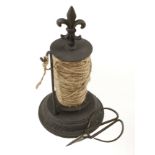 An unusual early iron string dispenser 10"h.