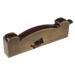 A shapely brass shoulder plane 9" x 1 1/4"with rosewood infill and hidden wedge,