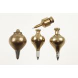 Four brass plumb bobs 2" to 2 1/2" G++