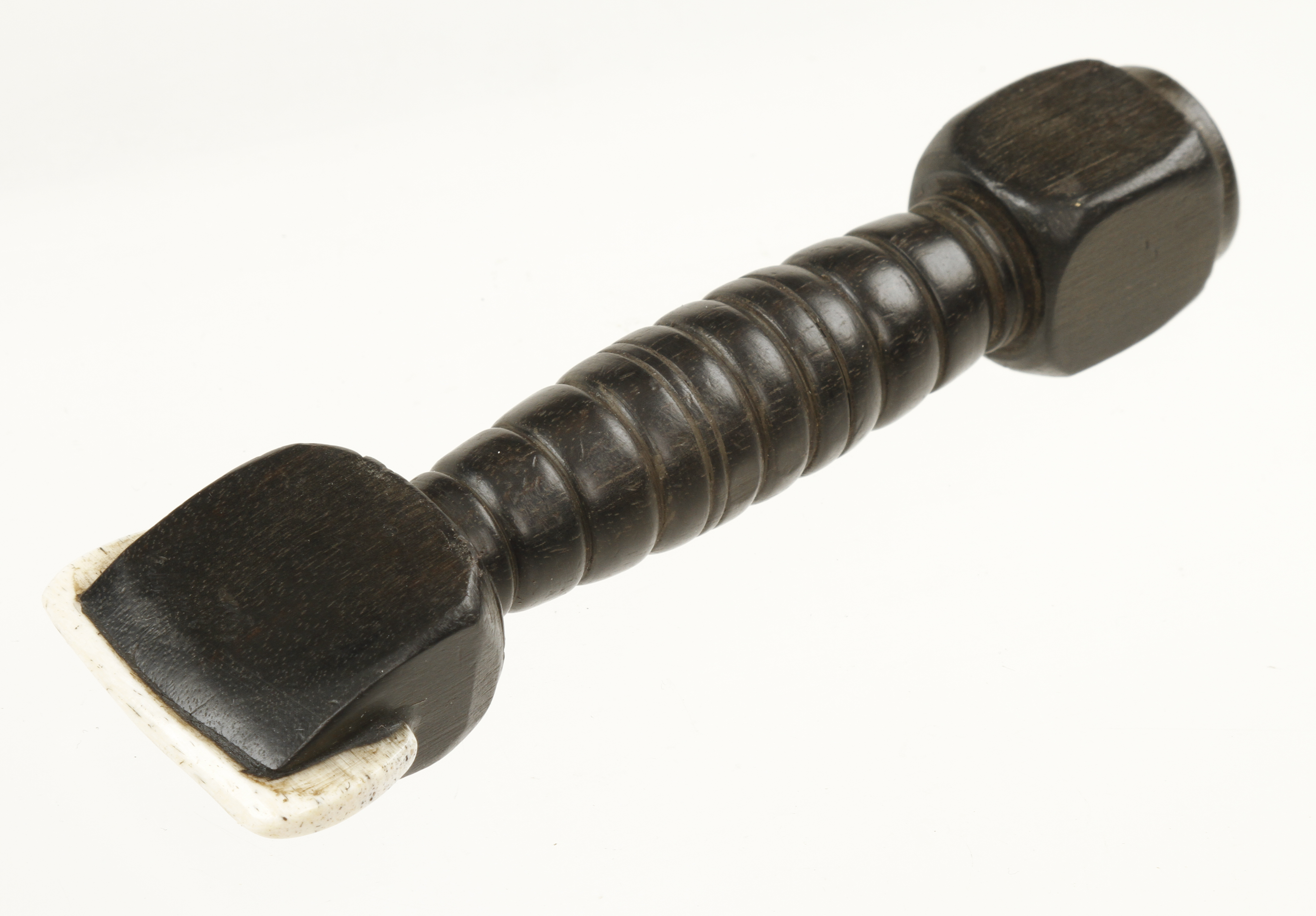 An early sailmaker's ebony seam rubber with whalebone wear piece and escutcheon in the head with C.
