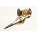 An early 6" steel tipped gunmetal plumb bob with brass top and knurled decoration on wood reel G+