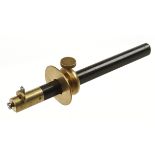 An ebony slitting gauge with heavy brass stock G+