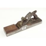 An attractive steel panel plane 15"x3" with shaped brass lever and over stuffed mahogany infill and