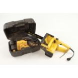 A MCCULLOCK electric chain saw(lacks mains cable) and a JCB belt sander