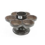 A shoemakers cast-iron revolving nail & tack disperser with seven removable cups and cast in the