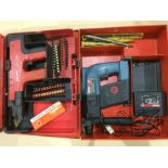 A BOSCH cordless SDS hammer drill and a HILT 1 DX450 nail gun