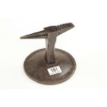 A small stake anvil in an iron base G