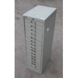 A 15 drawer steel cabinet.