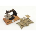 A small hand sewing machine by GRAIN and a postal scale on brass base G+