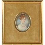 A Regency portrait miniature of a lady, her hair in ringlets,