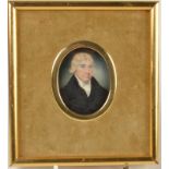 A George III portrait miniature of a gentleman in a blue coat, 6.