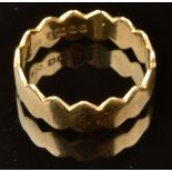 BREON O'CASEY An 18ct gold band with serrated edges Makers mark and hallmark for Birmingham