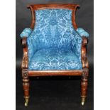A good George IV mahogany library chair with scrolling curved crest rail,