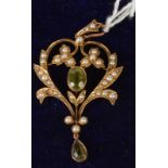 An Edwardian gold pendant set peridot and half pearls.