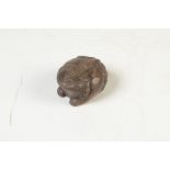 A lidded wooden box carved as a frog, length 7cm.