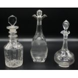 A small cut glass decanter with a silver mount,