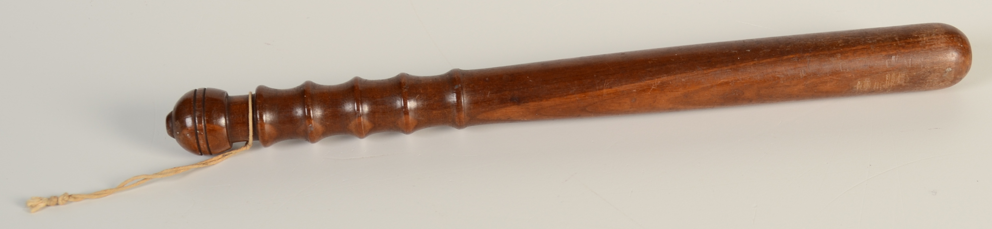 A turned lingnum vitae truncheon, length 39cm.