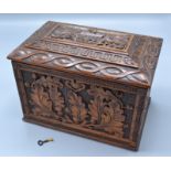 An oak stationary box carved with oak leaves and acorns,