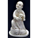 A Japanese ivory okimono, a peasant seated upon a sack looking upwards as he holds a money pouch,
