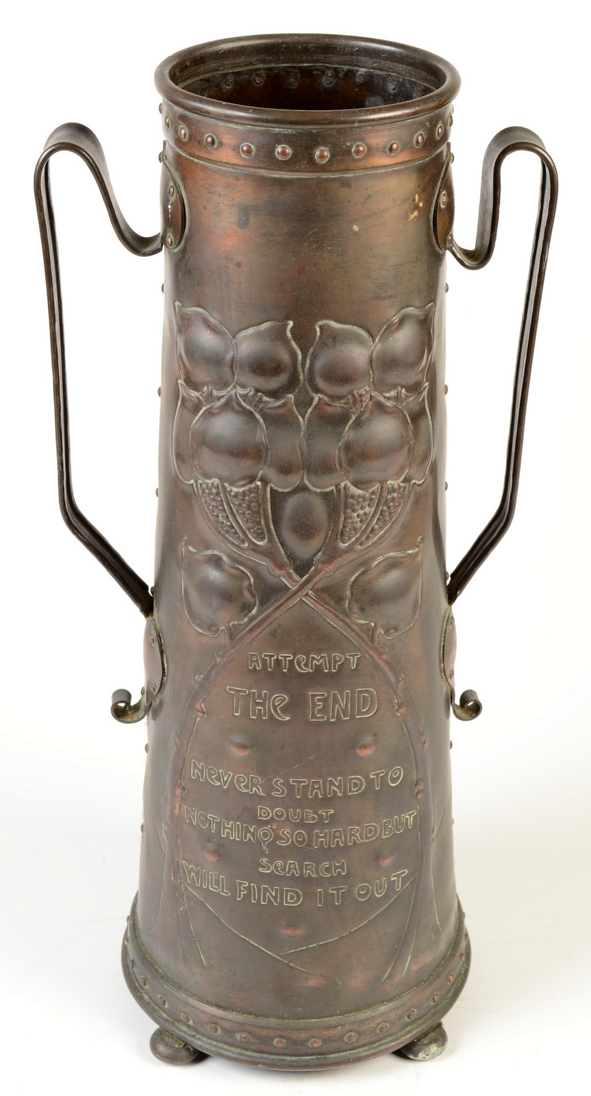 A fine Arts and Crafts copper vase of conical shape and with twin handles repousse decorated with