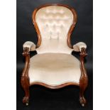 A Victorian buttoned spoon back, walnut framed open armchair,