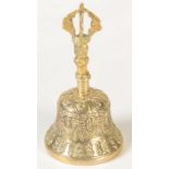 A Tibetan gilt metal hand bell, height 15.5cm.