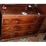 An 18th century mahogany chest of three long graduated drawers beneath a brushing slide,