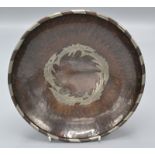 Hugh Wallis, an Arts and Crafts circular, planished copper bowl,