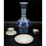 A 'Delft' porcelain blue and white vase and a Royal Crown Derby floral swag decorated trio.