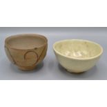 A Japanese 19th century chawan (tea bowl) decorated with a beige grey ground,