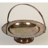 A silver cake basket by the Goldsmith and Silversmith Company,