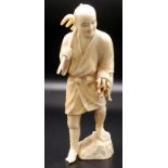 A Japanese walrus ivory okimono,