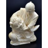 A Japanese ivory okimono, a seated actor holding an Oni mask. Late Meiji. Height 8.6cm.