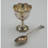 A silver cased christening egg cup with dissimilar spoon, Sheffield 1934.