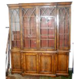 A walnut veneered break front bookcase in 18th century style with bracket feet,