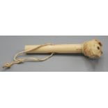 A fine ivory cane handle carved as the head of a hound with paperweight glass eyes, one ear chipped.