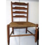 A Robin Nance lath back chair with grass seat.