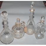 Three decanters and a jug.