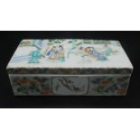 A Chinese rectangular porcelain artist's box decorated in famille verte with an interior scene with