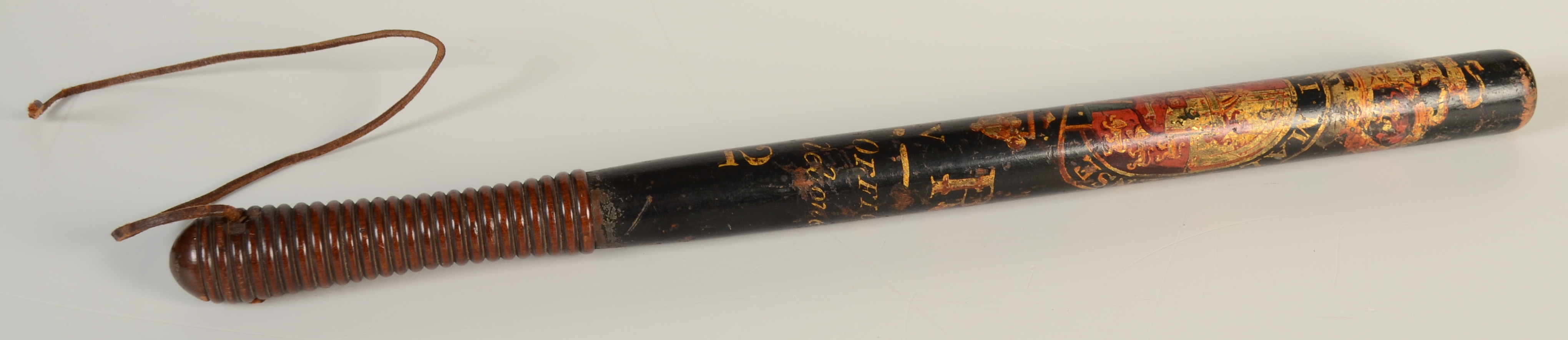 A George IV truncheon painted with the royal coat of arms above 'G. IV R.