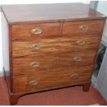 A George III mahogany chest of small proportions fitted two short and three long graduated drawers