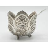 An Indian silver bowl in the shape of a lotus flower on three fish feet, height 8cm,