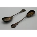 A pair of late Victorian flower and leaf engraved silver serving spoons,