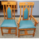 A set of eight light oak post war Arts and Crafts style dining chairs with pierced Gothic backs,